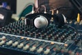 Silver headphones on a Studio audio mixer Royalty Free Stock Photo