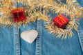 Silver heart decorated on jeans for background