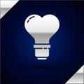 Silver Heart shape in a light bulb icon isolated on dark blue background. Love symbol. Valentine day symbol. Vector Royalty Free Stock Photo