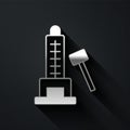 Silver High striker attraction with big hammer icon isolated on black background. Attraction for measuring strength