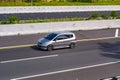 Silver Honda jazz or Honda fit vtec driving fast on trans jawa highway blurry in motion Royalty Free Stock Photo