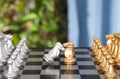 The silver horse chess piece surrenders when the two sides of the chess match Royalty Free Stock Photo