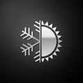 Silver Hot and cold symbol. Sun and snowflake icon isolated on black background. Winter and summer symbol. Long shadow