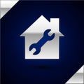 Silver House or home with wrench icon isolated on dark blue background. Adjusting, service, setting, maintenance, repair Royalty Free Stock Photo