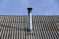 Silver iron chimney pipe of the stove in the house Royalty Free Stock Photo