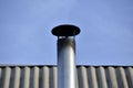 Silver iron chimney pipe of the stove in the house Royalty Free Stock Photo