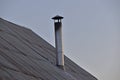 Silver iron chimney pipe of the stove in the house Royalty Free Stock Photo