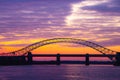 Silver Jubilee Bridge in Runcorn with the sun setting in the background Royalty Free Stock Photo