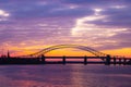 Silver Jubilee Bridge in Runcorn with the sun setting in the background Royalty Free Stock Photo