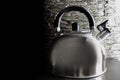 Silver kettle with whistle on black Royalty Free Stock Photo