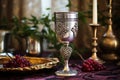 silver kiddush wine cup on a decorated table