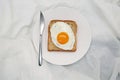 Silver Knife With Egg Toast On The White Plate