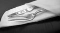 Silver knife and fork in linen serviette Royalty Free Stock Photo