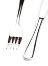 Silver knife and fork on a white background