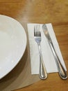 Silver knife, fork and the white dish Royalty Free Stock Photo