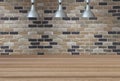 Silver lamps on the ceiling and a backdrop on a brick wall with