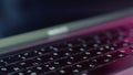 Silver laptop with black keybord details. Action. Close up of a new modern laptop, concept of technological progress and Royalty Free Stock Photo