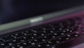 Silver laptop with black keybord details. Action. Close up of a new modern laptop, concept of technological progress and Royalty Free Stock Photo