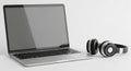 Silver Laptop Computer and Black Headphones on White Background technology audio Royalty Free Stock Photo