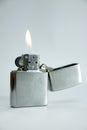 Silver lighter with flame. Royalty Free Stock Photo