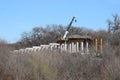 The New Silver Line goes airborne as it crosses the busy BNSF Tracks Royalty Free Stock Photo