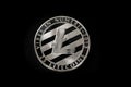 Silver litecoin coin on a black background