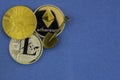 Litecoin, bitcoin shovel toy and etherium closeup Royalty Free Stock Photo