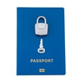 Silver lock and key lying on the blue passport