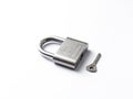 Silver lock with key stock image.