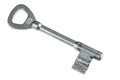 Silver locker key on white background. photo of mako Royalty Free Stock Photo