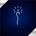 Silver Magic staff icon isolated on dark blue background. Magic wand, scepter, stick, rod. Vector Illustration. Royalty Free Stock Photo