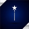 Silver Magic wand icon isolated on dark blue background. Star shape magic accessory. Magical power. Vector Illustration. Royalty Free Stock Photo