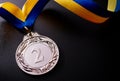 Silver medal on a dark background Royalty Free Stock Photo