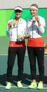Silver medalists team Switzerland Timea Bacsinszky (L) and Martina Hingis during medal ceremony after doubles final