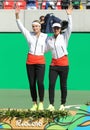 Silver medalists team Switzerland Timea Bacsinszky (L) and Martina Hingis during medal ceremony after doubles final Royalty Free Stock Photo