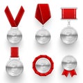 Silver medals with red ribbons  rosette  laurel wreaths realistic set. Metal awards  sport prizes Royalty Free Stock Photo