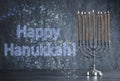 Silver menorah on table. Happy Hanukkah