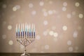 A silver menorah for the Jewish holiday Hanukkah with eight unlit candles Royalty Free Stock Photo
