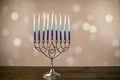 A silver menorah for the Jewish holiday Hanukkah with eight unlit candles Royalty Free Stock Photo