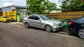 Silver Mercedes Benz C class C200 W203 parked on the side of the road Royalty Free Stock Photo