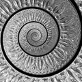 Silver metal abstract spiral fractal pattern on black background. Lattin floral pattern. Metallic paper spiral background. Traditi