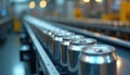 Silver metal cans move in continuous line on conveyor belt within modern factory. Image captures efficient, automated process of Royalty Free Stock Photo