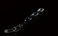 Silver metal chain with blue link 3D rendering