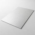Silver metal checker plate with a diamond pattern covers a flat surface Royalty Free Stock Photo