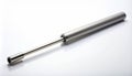 Silver Metal Cylinder with Rod on White Reflective Background Studio Shot Royalty Free Stock Photo