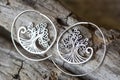 Metal decorative oriental spirale design earrings on natural neutral background Royalty Free Stock Photo