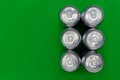 Silver metal drinks cans on green background Royalty Free Stock Photo