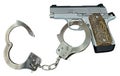 Silver 9mm Gun Handcuffed Royalty Free Stock Photo
