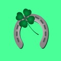 Silver metal horseshoe and green cloverleaf eps10 Royalty Free Stock Photo