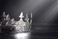 Silver Metal King or Queens Crown on a black Wood Table Royalty Free Stock Photo